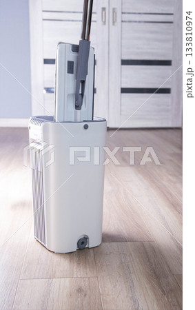 Gray modern bucket for cleaning and cleaning the room, copy space for text, industry 133810974