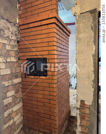 Oven with a plate in a heating stove. Stove construction. Oven with a plate in a heating stove. Stove construction. 133811058