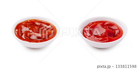 Two bowls of ketchup side by side on a plain background 133811598