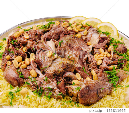 Delicious platter of roasted meat served over fragrant rice with nuts Delicious platter of roasted meat served over fragrant rice with nuts 133811665