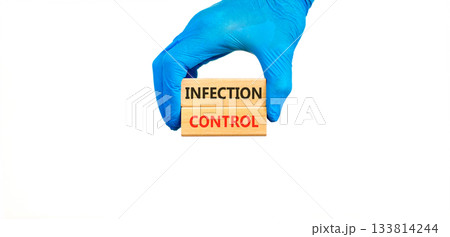 Infection control symbol. Concept words Infection control on beautiful wooden blocks. Doctor's hand in medical glove. Beautiful white background. Medical healthy lifestyle infection control concept. 133814244