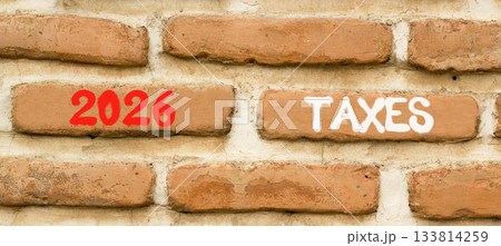 2026 taxes new year symbol. Concept words 2026 taxes on beautiful brown brick wall. Beautiful brown brick wall background. Business and 2026 taxes new year concept. Copy space. 2026 taxes new year symbol. Concept words 2026 taxes on beautiful brown brick wall. Beautiful brown brick wall background. Business and 2026 taxes new year concept. Copy space. 133814259