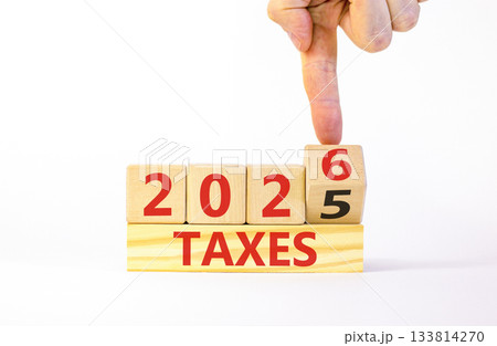 2026 taxes new year symbol. Concept words 2026 taxes on beautiful wooden blocks. Beautiful white paper background. Businessman's hand. Business and 2026 taxes new year concept. Copy space. 2026 taxes new year symbol. Concept words 2026 taxes on beautiful wooden blocks. Beautiful white paper background. Businessman's hand. Business and 2026 taxes new year concept. Copy space. 133814270