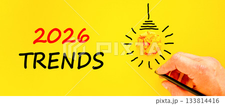 2026 Trends new year symbol. Concept words 2026 Trends on beautiful yellow paper. Beautiful orange paper background. Businessman's hand with pen. Business 2026 Trends new year concept. Copy space. 2026 Trends new year symbol. Concept words 2026 Trends on beautiful yellow paper. Beautiful orange paper background. Businessman's hand with pen. Business 2026 Trends new year concept. Copy space. 133814416