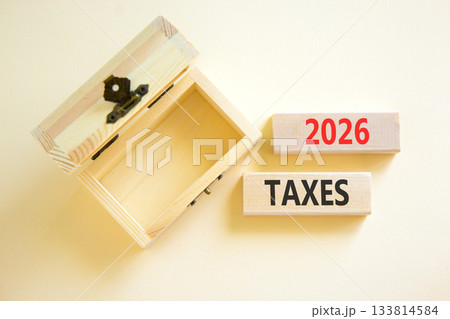 2026 taxes new year symbol. Concept words 2026 taxes on beautiful wooden blocks. Beautiful white paper background. Beautiful empty wooden chest. Business and 2026 taxes new year concept. Copy space. 2026 taxes new year symbol. Concept words 2026 taxes on beautiful wooden blocks. Beautiful white paper background. Beautiful empty wooden chest. Business and 2026 taxes new year concept. Copy space. 133814584
