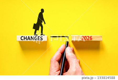 Changes 2026 symbol. Concept words Changes 2026 on beautiful wooden blocks. Beautiful yellow background. Businessman holds pencil. Businessman icon. Business and changes 2026 concept. Copy space. Changes 2026 symbol. Concept words Changes 2026 on beautiful wooden blocks. Beautiful yellow background. Businessman holds pencil. Businessman icon. Business and changes 2026 concept. Copy space. 133814588