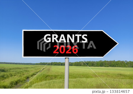 Grants 2026 symbol. Concept words Grants 2026 on beautiful black road sign. Beautiful green grass field forest and blue sky background. Business and grants 2026 concept. Copy space. Grants 2026 symbol. Concept words Grants 2026 on beautiful black road sign. Beautiful green grass field forest and blue sky background. Business and grants 2026 concept. Copy space. 133814657
