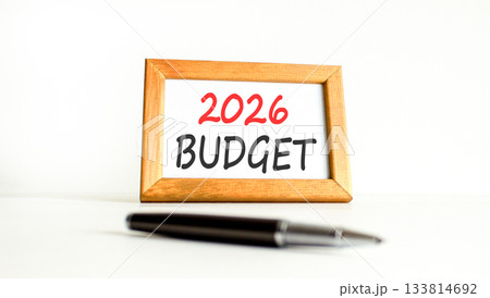 2026 Budget symbol. Concept words 2026 Budget on beautiful wooden picture frame. Beautiful white paper background. Beautiful black pen. Business and 2026 budget concept. Copy space. 2026 Budget symbol. Concept words 2026 Budget on beautiful wooden picture frame. Beautiful white paper background. Beautiful black pen. Business and 2026 budget concept. Copy space. 133814692