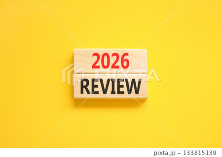 2026 Review symbol. Concept words 2026 Review on beautiful wooden blocks. Beautiful yellow paper background. Business and 2026 review concept. Copy space. 133815139
