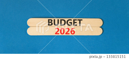 Budget 2026 symbol. Concept words Budget 2026 on beautiful wooden sticks. Beautiful blue paper background. Business and budget 2026 concept. Copy space. Budget 2026 symbol. Concept words Budget 2026 on beautiful wooden sticks. Beautiful blue paper background. Business and budget 2026 concept. Copy space. 133815151