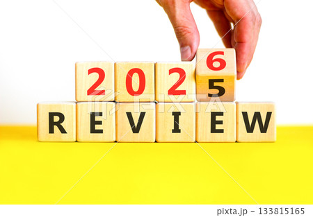 2026 Review symbol. Concept words 2026 Review on beautiful wooden blocks. Beautiful white and yellow paper background. Businessman's hand. Business and 2026 review concept. Copy space. 2026 Review symbol. Concept words 2026 Review on beautiful wooden blocks. Beautiful white and yellow paper background. Businessman's hand. Business and 2026 review concept. Copy space. 133815165