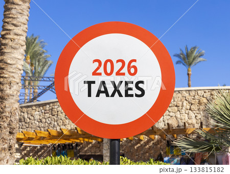2026 taxes new year symbol. Concept words 2026 taxes on beautiful white and red road sign. Beautiful palm trees palm-trees and blue sky background. Business and 2026 taxes new year concept. Copy space 133815182