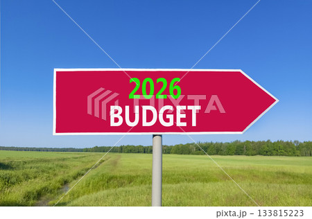 2026 Budget symbol. Concept words 2026 Budget on beautiful red road sign. Beautiful green grass field forest and blue sky background. Business and 2026 budget concept. Copy space. 2026 Budget symbol. Concept words 2026 Budget on beautiful red road sign. Beautiful green grass field forest and blue sky background. Business and 2026 budget concept. Copy space. 133815223