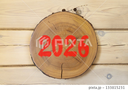 Business concept of 2026 new year symbol. Concept number 2026 Happy new year on beautiful wooden circle. Beautiful wooden wall background. Business 2026 happy new year concept. Copy space. 133815231