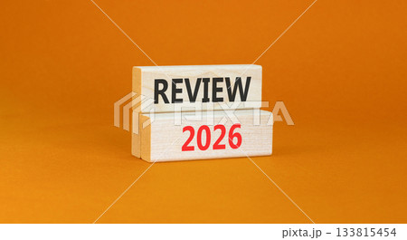 Review 2026 symbol. Concept words Review 2026 on beautiful wooden blocks. Beautiful orange paper background. Business and review 2026 concept. Copy space. 133815454