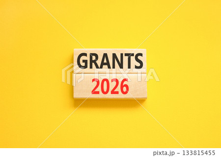 Grants 2026 symbol. Concept words Grants 2026 on beautiful wooden blocks. Beautiful yellow paper background. Business and grants 2026 concept. Copy space. 133815455
