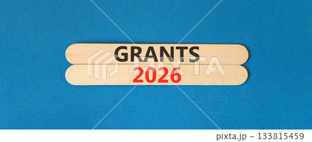 Grants 2026 symbol. Concept words Grants 2026 on beautiful wooden sticks. Beautiful blue paper background. Business and grants 2026 concept. Copy space. Grants 2026 symbol. Concept words Grants 2026 on beautiful wooden sticks. Beautiful blue paper background. Business and grants 2026 concept. Copy space. 133815459