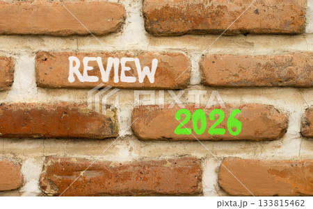 Review 2026 symbol. Concept words Review 2026 on beautiful brown brick wall. Beautiful brown brick wall background. Business and review 2026 concept. Copy space. 133815462