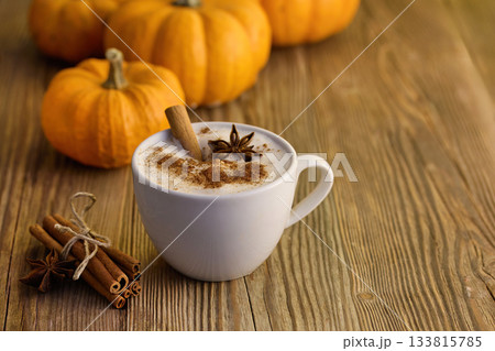 Autumn Pumpkin Spice Latte. A warm spiced latte with cinnamon and star anise, surrounded by pumpkins 133815785