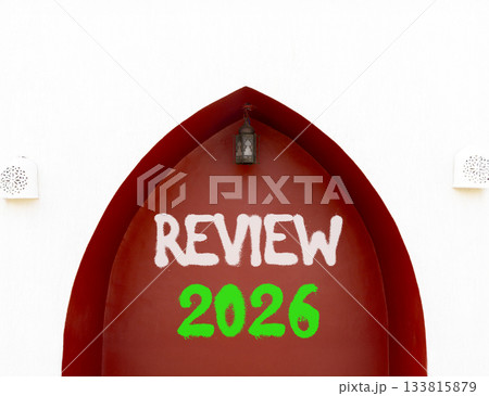 Review 2026 symbol. Concept words Review 2026 on beautiful white and red wall. Beautiful white and red wall background. Business and review 2026 concept. Copy space. 133815879