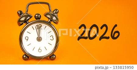 Business concept of 2026 new year symbol. Concept number 2026 on beautiful white paper. Beautiful orange background. Beautiful black alarm clock. Business 2026 happy new year concept. Copy space. Business concept of 2026 new year symbol. Concept number 2026 on beautiful white paper. Beautiful orange background. Beautiful black alarm clock. Business 2026 happy new year concept. Copy space. 133815950