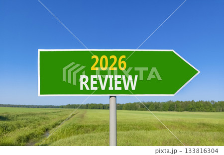 2026 Review symbol. Concept words 2026 Review on beautiful green road sign. Beautiful green grass field forest and blue sky background. Business and 2026 review concept. Copy space. 2026 Review symbol. Concept words 2026 Review on beautiful green road sign. Beautiful green grass field forest and blue sky background. Business and 2026 review concept. Copy space. 133816304