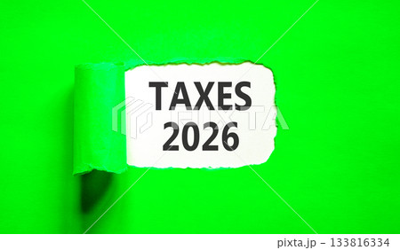 Taxes 2026 new year symbol. Concept words Taxes 2026 on beautiful white paper. Beautiful green paper background. Business and taxes 2026 new year concept. Copy space. 133816334