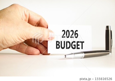 2026 Budget symbol. Concept words 2026 Budget on beautiful white card. Beautiful white paper background. Businessman's hand. Business and 2026 budget concept. Copy space. 2026 Budget symbol. Concept words 2026 Budget on beautiful white card. Beautiful white paper background. Businessman's hand. Business and 2026 budget concept. Copy space. 133816526