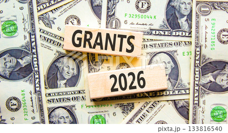 Grants 2026 symbol. Concept words Grants 2026 on beautiful wooden blocks. Beautiful dollar bills background. Dollar bills. Business and grants 2026 concept. Copy space. Grants 2026 symbol. Concept words Grants 2026 on beautiful wooden blocks. Beautiful dollar bills background. Dollar bills. Business and grants 2026 concept. Copy space. 133816540