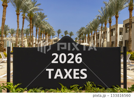 2026 taxes new year symbol. Concept words 2026 taxes on beautiful black road sign. Beautiful palm trees palm-trees and blue sky background. Business and 2026 taxes new year concept. Copy space. 2026 taxes new year symbol. Concept words 2026 taxes on beautiful black road sign. Beautiful palm trees palm-trees and blue sky background. Business and 2026 taxes new year concept. Copy space. 133816560
