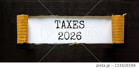 Taxes 2026 new year symbol. Concept words Taxes 2026 on beautiful white paper. Beautiful black paper background. Business and taxes 2026 new year concept. Copy space. Taxes 2026 new year symbol. Concept words Taxes 2026 on beautiful white paper. Beautiful black paper background. Business and taxes 2026 new year concept. Copy space. 133816589