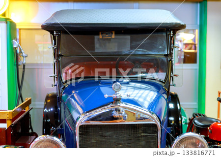 Classic vintage car on display in museum, showcasing its intricate design historical significance 133816771