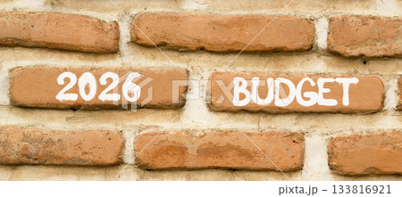 2026 Budget symbol. Concept words 2026 Budget on beautiful brown brick wall. Beautiful brown brick wall background. Business and 2026 budget concept. Copy space. 2026 Budget symbol. Concept words 2026 Budget on beautiful brown brick wall. Beautiful brown brick wall background. Business and 2026 budget concept. Copy space. 133816921