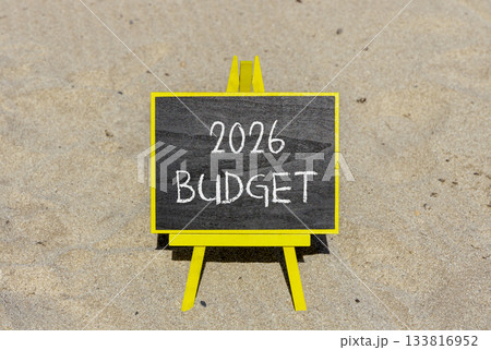 2026 Budget symbol. Concept words 2026 Budget on beautiful black blackboard. Beautiful sand beach background. Business and 2026 budget concept. Copy space. 2026 Budget symbol. Concept words 2026 Budget on beautiful black blackboard. Beautiful sand beach background. Business and 2026 budget concept. Copy space. 133816952