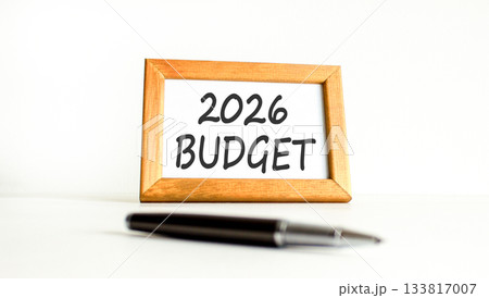 2026 Budget symbol. Concept words 2026 Budget on beautiful wooden picture frame. Beautiful white paper background. Beautiful black pen. Business and 2026 budget concept. Copy space. 2026 Budget symbol. Concept words 2026 Budget on beautiful wooden picture frame. Beautiful white paper background. Beautiful black pen. Business and 2026 budget concept. Copy space. 133817007