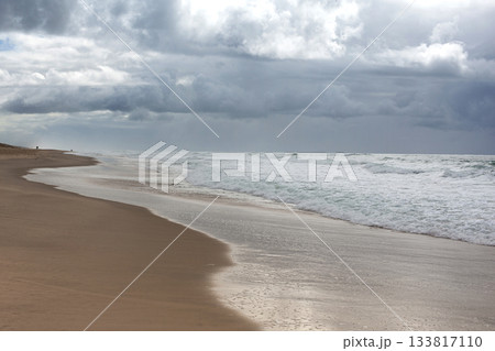 The ebb and flow of the tide on the shore The ebb and flow of the tide on the shore 133817110