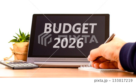 Budget 2026 symbol. Concept words Budget 2026 on beautiful black tablet screen. Beautiful white background. Businessman's hand. Business and budget 2026 concept. Copy space. 133817219