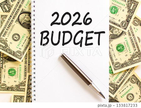 2026 Budget symbol. Concept words 2026 Budget on beautiful white note. Beautiful dollar bills background. Black pen. Dollar bills. Business and 2026 budget concept. Copy space. 133817233