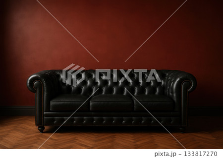 Black Leather Chesterfield Sofa Against Dark Red Wall with Copy Space Black Leather Chesterfield Sofa Against Dark Red Wall with Copy Space 133817270
