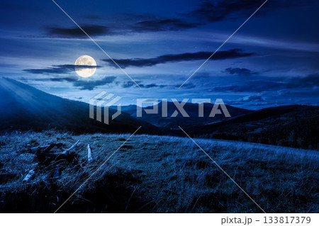 beautiful countryside at night. wonderful summertime landscape in mountains in full moon light. scenic view of grassy field and rolling hills. background for rural land investment or abstract concepts beautiful countryside at night. wonderful summertime landscape in mountains in full moon light. scenic view of grassy field and rolling hills. background for rural land investment or abstract concepts 133817379