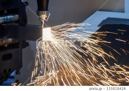 Close up scene the fiber laser cutting machine cut the square stainless steel tube. Close up scene the fiber laser cutting machine cut the square stainless steel tube. 133818426