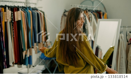 A Stylish Fashion Model Posing Gracefully in a Trendy Boutique Surrounded by Unique Accessories A Stylish Fashion Model Posing Gracefully in a Trendy Boutique Surrounded by Unique Accessories 133818514