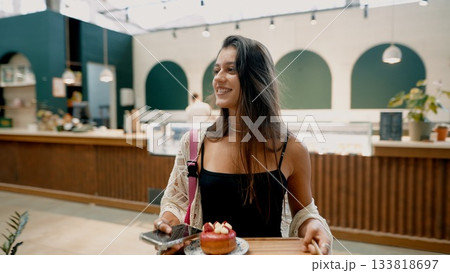 Joyful Woman Enjoying Dessert in Trendy Caf Joyful Woman Enjoying Dessert in Trendy Caf 133818697