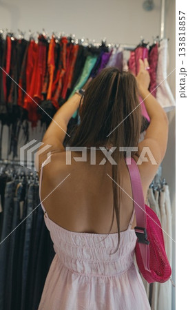 Discovering and purchasing vibrant, colorful fashion accessories at a trendy boutique today Discovering and purchasing vibrant, colorful fashion accessories at a trendy boutique today 133818857