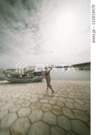 A Scenic View of a Woman Enjoying the Beautiful Water Surrounded by Boats Nearby A Scenic View of a Woman Enjoying the Beautiful Water Surrounded by Boats Nearby 133819470