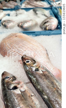 Explore the exquisite and fresh seafood display that is showcased at the local fish market Explore the exquisite and fresh seafood display that is showcased at the local fish market 133819605