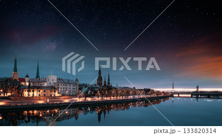 Riga, Latvia, Europe. Cityscape In Morning Time. Night View Of Castle, Dome Cathedral And St. Peter's Church. Popular Place With Famous Landmarks. UNESCO. Old Town In Street Christmas Decoration Riga, Latvia, Europe. Cityscape In Morning Time. Night View Of Castle, Dome Cathedral And St. Peter's Church. Popular Place With Famous Landmarks. UNESCO. Old Town In Street Christmas Decoration 133820314