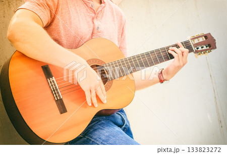 Trendy guy with guitar outdoor Trendy guy with guitar outdoor 133823272