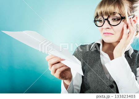 Fly fear. Woman holding airplane in hand. Fly fear. Woman holding airplane in hand. 133823403