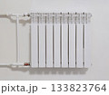 A white radiator with a white pipe attached to it 133823764